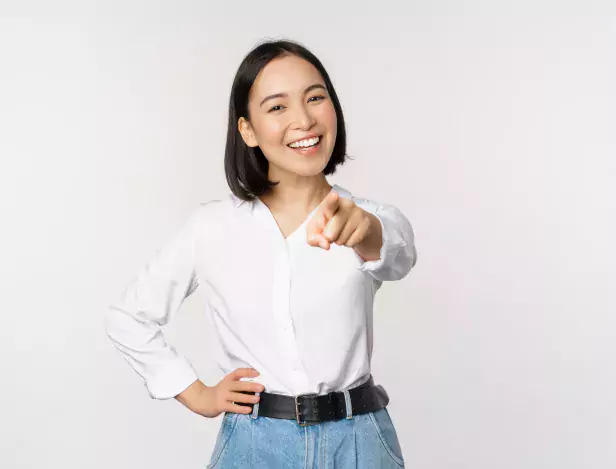 its-you-beautiful-young-asian-woman-company-manager-pointing-finger-at-camera-and-smiling-choosing-inviting-people-recruiting-standing-over-white-background