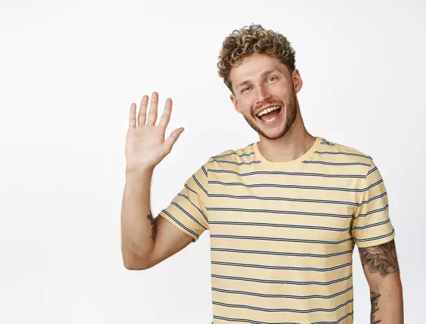 friendly-blond-guy-saying-hello-waving-hand-smiling-camera-standing-white-background-176420-49363